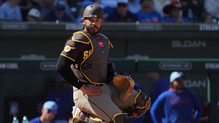 Mar 4, 2025; Mesa, Arizona, USA; San Diego Padres catcher Luis Campusano (12) looks for a sign against the Chicago Cubs in the third inning at Sloan Park. Mandatory Credit: Rick Scuteri-Imagn Images