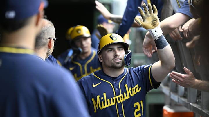 Jun 19, 2025; Chicago, Illinois, USA;  Milwaukee Brewers third baseman Caleb Durbin (21) celebrates in the dugout after he hits a two run home run  against the Chicago Cubs during the second inning at Wrigley Field. Mandatory Credit: Matt Marton-Imagn Images