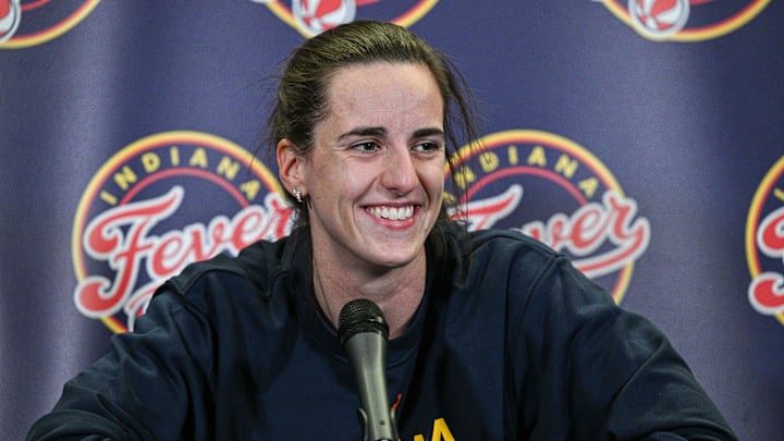 Indiana Fever guard Caitlin Clark (22) answers questions before the preseason game against the Brazil National Team at Carver-Haweye Arena.