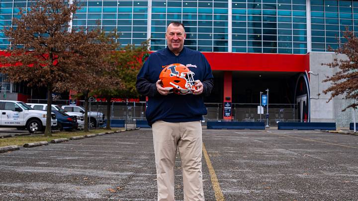 Illinois football coach Bret Bielema poses in front of Nissan Stadium in Nashville, Tennessee, where his Illini will face Tennessee in Tuesday's Music City Bowl.