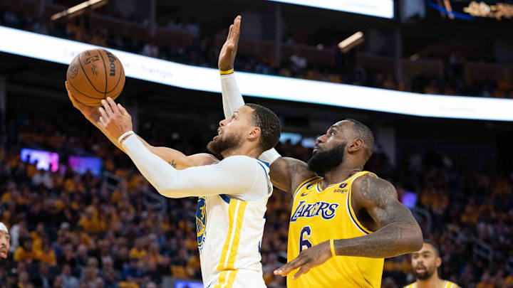  Golden State Warriors guard Stephen Curry (30) shoots the basketball against Los Angeles Lakers forward LeBron James (6) during the third quarter in game five of the 2023 NBA playoffs conference semifinals round at Chase Center. Mandatory Credit: Kyle Terada-Imagn Images