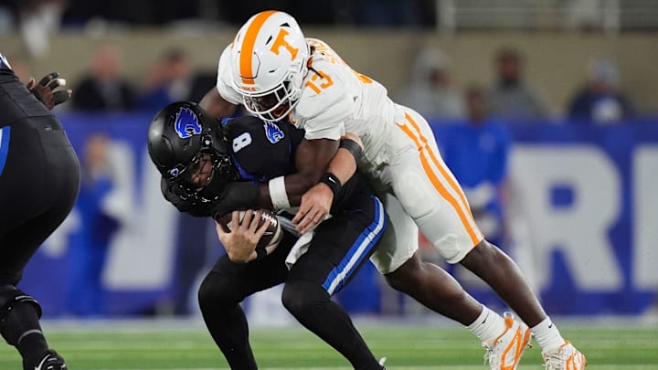 Tennessee linebacker Edwin Spillman (13) sacks Kentucky quarterback Cutter Boley (8) during a NCAA football game against Kentucky at Kroger Field in Lexington, Kentucky on Oct. 25, 2025.