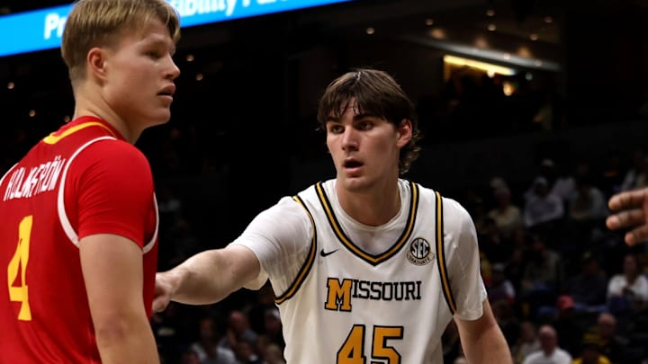 Nov 9, 2025; Columbia, Missouri, USA; Missouri Tigers forward Luke Northweather (45) prepares to defend VMI guard Linus Holmstrom (4) against the VMI Keydets at Mizzou Arena. 