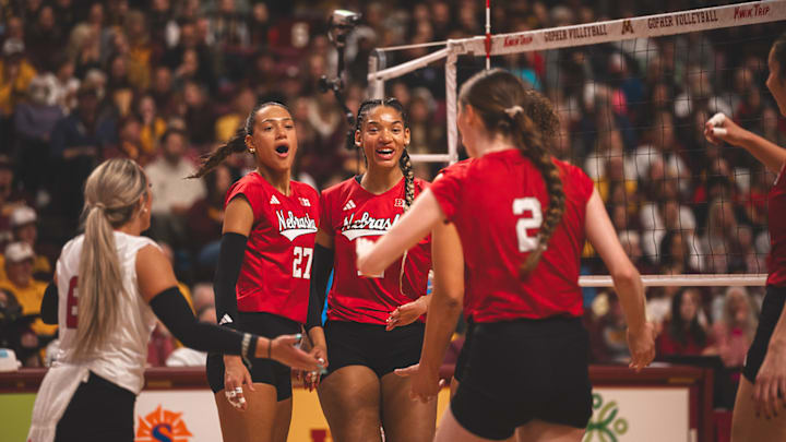 Taylor Landfair, center, celebrates with her teammates after a points against Nebraska. Landfair, who spent her first four years at Minnesota, put up 11 kills on 20 swings against the Gophers. 