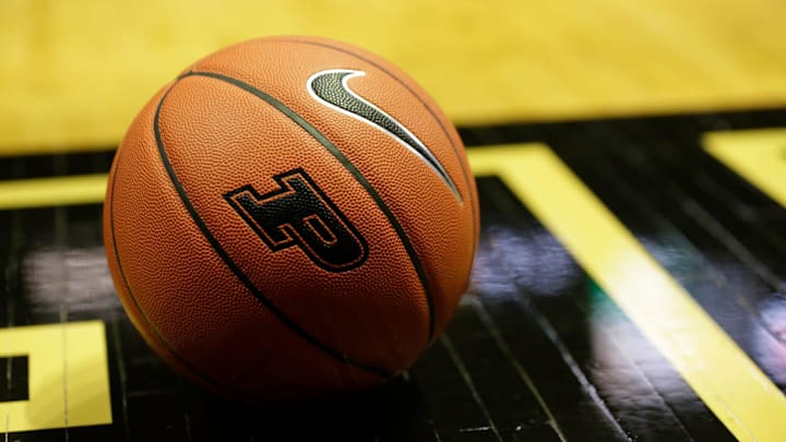 A Nike Basketball with a Purdue logo sits on the court of Mackey Arena.
