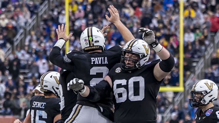 Dec 27, 2024; Birmingham, AL, USA; Vanderbilt Commodores quarterback Diego Pavia (2) celebrates his touchdown run against the Georgia Tech Yellow Jackets with Vanderbilt Commodores offensive lineman Duncan MacDonald (60) during the first half of the 2024 Birmingham Bowl at Protective Stadium. Mandatory Credit: Vasha Hunt-Imagn Images Dec 27, 2024; Birmingham, AL, USA; Vanderbilt Commodores quarterback Diego Pavia (2) celebrates his touchdown run against the Georgia Tech Yellow Jackets with Vanderbilt Commodores offensive lineman Duncan MacDonald (60) during the first half of the 2024 Birmingham Bowl at Protective Stadium. Mandatory Credit: Vasha Hunt-Imagn Images