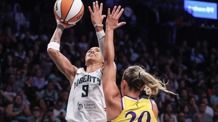 Jul 3, 2025; Brooklyn, New York, USA;  New York Liberty guard Natasha Cloud (9) looks to post up against Los Angeles Sparks guard Julie Allemand (20) in the third quarter at Barclays Center. Mandatory Credit: Wendell Cruz-Imagn Images