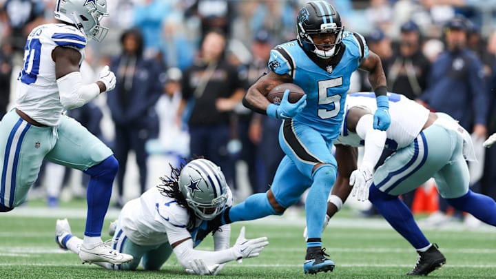 Oct 12, 2025; Charlotte, North Carolina, USA; Carolina Panthers running back Rico Dowdle (5) runs with the ball during the second half against the Dallas Cowboys at Bank of America Stadium.