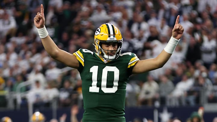 Jan 14, 2024; Arlington, Texas, USA; Green Bay Packers quarterback Jordan Love (10) reacts after a touchdown against the Dallas Cowboys in the first quarter for the 2024 NFC wild card game at AT&T Stadium. Mandatory Credit: Tim Heitman-Imagn Images