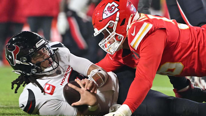 Dec 7, 2025; Kansas City, Missouri, USA; Kansas City Chiefs defensive end George Karlaftis (56) sacks Houston Texans quarterback C.J. Stroud (7) during the fourth quarter at GEHA Field at Arrowhead Stadium. Mandatory Credit: Amy Kontras-Imagn Images