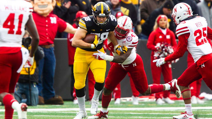 Iowa tight end T.J. Hockenson (38) gets tackled by Nebraska's Tyrin Ferguson (43) during a Big Ten Conference NCAA football game on Friday, Nov. 23, 2018, at Kinnick Stadium in Iowa City.