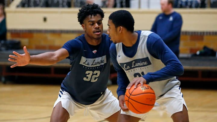 La Lumiere junior Jalen Haralson (32) defends teammate Ace Bucker during an open practice Thursday, Nov. 9, 2023, at the La Porte Civic Auditorium.