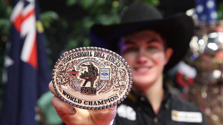Jess Lockwood showinghis World Champion PBR buckle.