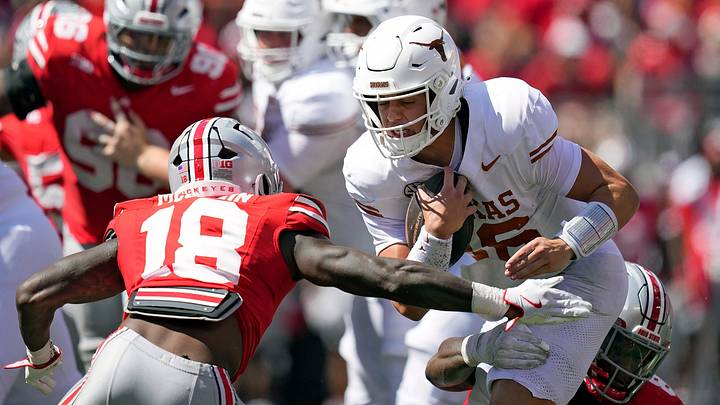Ohio State Buckeyes safety Jaylen McClain (18) tries to tackle Texas Longhorns quarterback Arch Manning (16) in the fourth quarter at Ohio Stadium. 