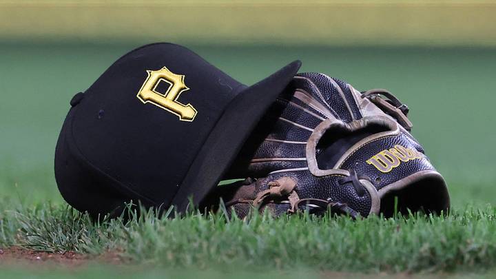 Sep 16, 2025; Pittsburgh, Pennsylvania, USA; A hat and glove belonging to Pittsburgh Pirates third baseman Jared Triolo (not pictured) on the field against the Chicago Cubs during the sixth inning at PNC Park. Mandatory Credit: Charles LeClaire-Imagn Images Sep 16, 2025; Pittsburgh, Pennsylvania, USA; A hat and glove belonging to Pittsburgh Pirates third baseman Jared Triolo (not pictured) on the field against the Chicago Cubs during the sixth inning at PNC Park. Mandatory Credit: Charles LeClaire-Imagn Images