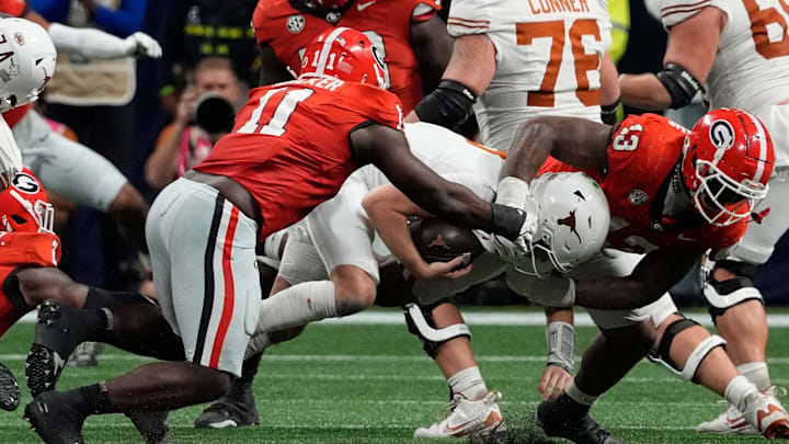 ATLANTA FALCONS: Georgia linebacker Jalon Walker (11) and Georgia defensive lineman Mykel Williams (13) take down Texas quarterback Quinn Ewers (3) during the second half of the SEC championship game against Texas in Atlanta, on Saturday, Dec. 7, 2024.