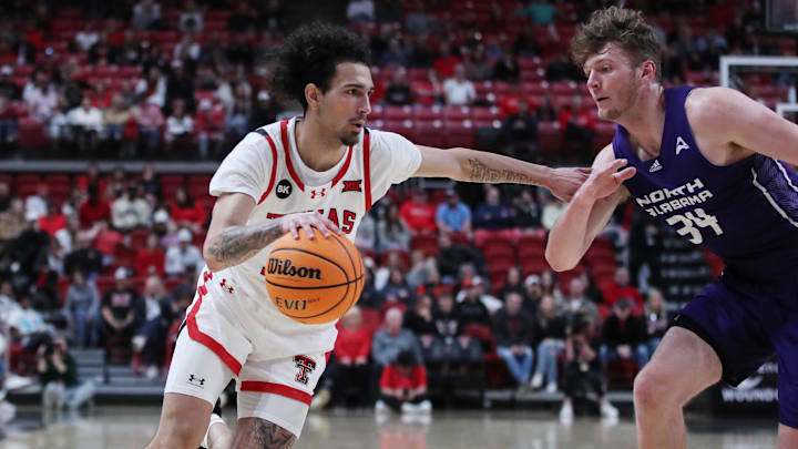 Jan 1, 2024; Lubbock, Texas, USA;  Texas Tech Red Raiders guard Pop Isaacs (2) works the ball