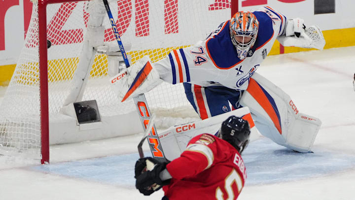 Jun 9, 2025; Sunrise, Florida, USA; Florida Panthers defenseman Aaron Ekblad (5) scores during the third period against Edmonton Oilers goaltender Stuart Skinner (74) in game three of the 2025 Stanley Cup Final at Amerant Bank Arena. Mandatory Credit: Jim Rassol-Imagn Images