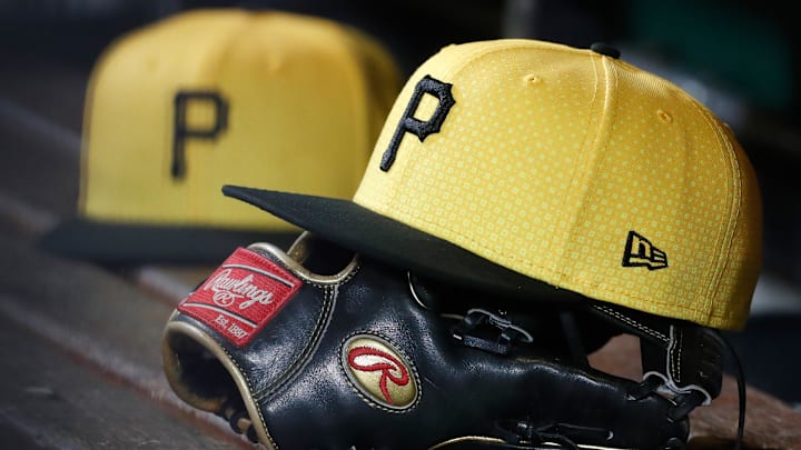 Sep 16, 2023; Pittsburgh, Pennsylvania, USA;  Pittsburgh Pirates hats and gloves in the dugout against the New York Yankees during the sixth inning at PNC Park.