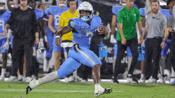 Nov 11, 2023; Orlando, Florida, USA; UCF Knights running back RJ Harvey (7) carries the ball during the second half against the Oklahoma State Cowboys at FBC Mortgage Stadium. Mandatory Credit: Mike Watters-USA TODAY Sports