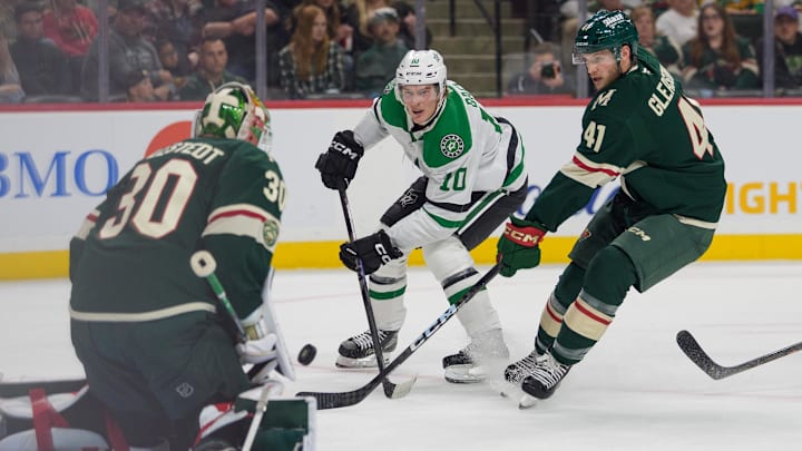 Sep 25, 2025; Saint Paul, Minnesota, USA; Dallas Stars center Oskar Back (10) shoots on Minnesota Wild goaltender Jesper Wallstedt (30) with defenseman Ben Gleason (41) on defense in the first period at Grand Casino Arena. Mandatory Credit: Matt Blewett-Imagn Images