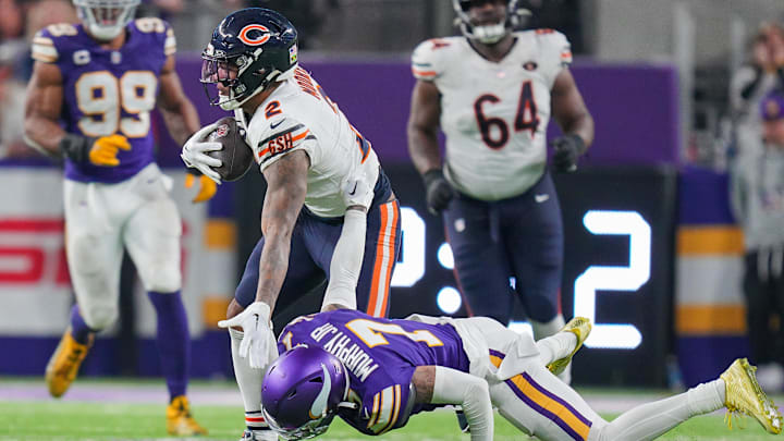 Nov 27, 2023; Minneapolis, Minnesota, USA; Chicago Bears wide receiver DJ Moore (2) runs after the catch against the Minnesota Vikings cornerback Byron Murphy Jr. (7) in the fourth quarter at U.S. Bank Stadium. Mandatory Credit: Brad Rempel-Imagn Images