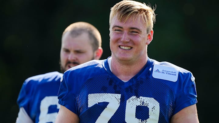 Indianapolis Colts offensive tackle Bernhard Raimann (79) smiles while walking to warm up Saturday, July 27, 2024, during the Indianapolis Colts’ training camp at Grand Park Sports Complex in Westfield. Indianapolis Colts offensive tackle Bernhard Raimann (79) smiles while walking to warm up Saturday, July 27, 2024, during the Indianapolis Colts’ training camp at Grand Park Sports Complex in Westfield.