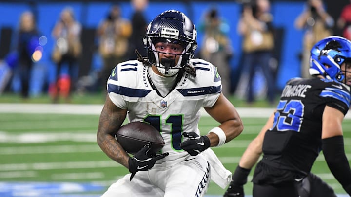 Seattle Seahawks wide receiver Jaxon Smith-Njigba (11) runs the ball against the Detroit Lions in the third quarter at Ford Field. 