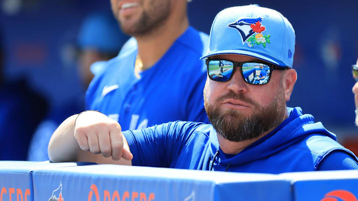 Toronto Blue Jays manager John Schneider (14) looks on against Team Canada at TD Ballpark. Toronto Blue Jays manager John Schneider (14) looks on against Team Canada at TD Ballpark.