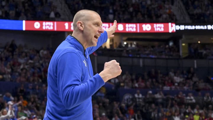 Mar 14, 2025; Nashville, TN, USA;  Kentucky Wildcats head coach Mark Pope screams to his team against the Alabama Crimson Tideduring the first half at Bridgestone Arena. Mandatory Credit: Steve Roberts-Imagn Images