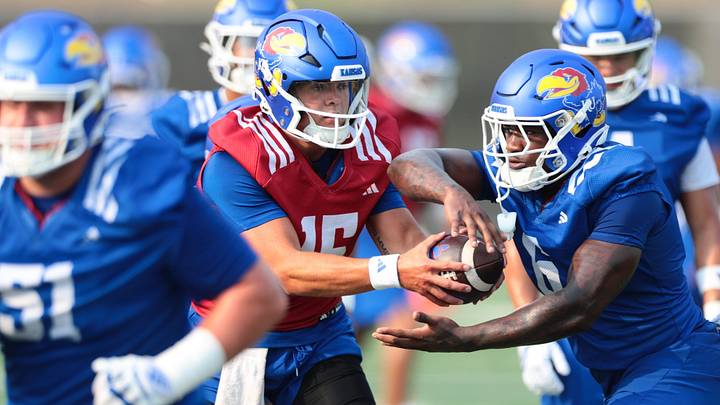 Kansas redshirt junior quarterback Cole Ballard (15) makes a handoff to redshirt junior running back Yasin Willis (6) during fall camp practice on Aug. 4, 2026. Kansas redshirt junior quarterback Cole Ballard (15) makes a handoff to redshirt junior running back Yasin Willis (6) during fall camp practice on Aug. 4, 2026.