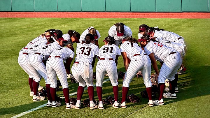 May 26, 2024; Austin, Texas; USA: The Texas A&M Aggies' women's softball team huddles up prior to first pitch at Red & Charline McCombs Field for Game 3 of the NCAA Tournament Super Regionals.