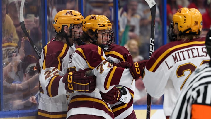 Apr 6, 2023; Tampa, Florida, USA; Minnesota forward Rhett Pitlick (77) celebrates after scoring a goal against Boston University in the first period in the semifinals of the 2023 Frozen Four college ice hockey tournament at Amalie Arena. Mandatory Credit: Nathan Ray Seebeck-Imagn Images