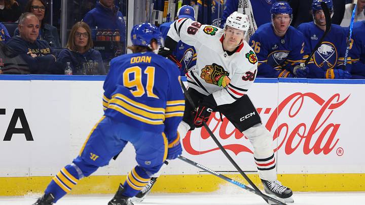 Oct 3, 2026; Buffalo, New York, USA;  Chicago Blackhawks defenseman Ethan del Mastro (38) looks to make a pass as Buffalo Sabres right wing Josh Doan (91) defends during the first period at KeyBank Center. Mandatory Credit: Timothy T. Ludwig-Imagn Images
