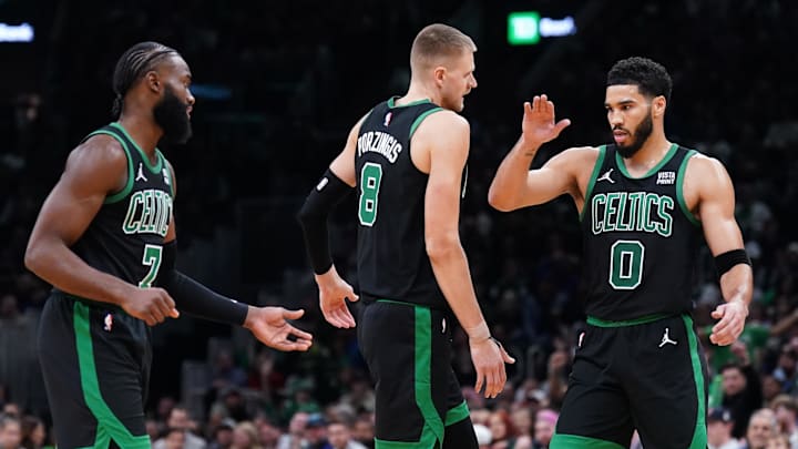 Nov 13, 2023; Boston, Massachusetts, USA: Boston Celtics forward Jayson Tatum (0), center Kristaps Porzingis (8) and guard Jaylen Brown (7) react after a play against the New York Knicks in the second quarter at TD Garden. Mandatory Credit: David Butler II-Imagn Images Nov 13, 2023; Boston, Massachusetts, USA: Boston Celtics forward Jayson Tatum (0), center Kristaps Porzingis (8) and guard Jaylen Brown (7) react after a play against the New York Knicks in the second quarter at TD Garden. Mandatory Credit: David Butler II-Imagn Images