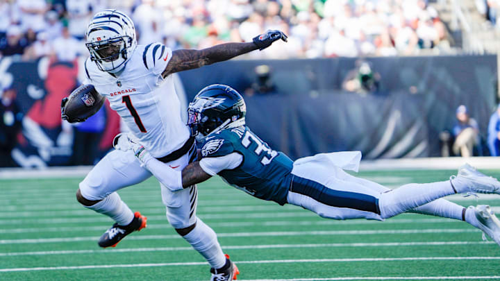 Cincinnati Bengals wide receiver Ja'Marr Chase (1) tries to break free from Philadelphia Eagles cornerback Isaiah Rodgers (34) at Paycor Stadium Sunday October 27, 2024. The Bengals lost 37-17 and remain winless at home.