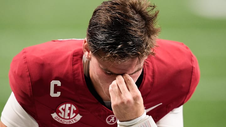 Dec 6, 2025; Atlanta, GA, USA; Alabama Crimson Tide quarterback Ty Simpson (15) kneels before the game against the Georgia Bulldogs during the 2025 SEC Championship game at Mercedes-Benz Stadium. Mandatory Credit: Dale Zanine-Imagn Images