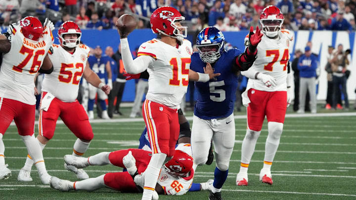 Sep 21, 2025; East Rutherford, New Jersey, USA; Kansas City Chiefs quarterback Patrick Mahomes (15) throws against New York Giants linebacker Kayvon Thibodeaux (5) in the fourth quarter at MetLife Stadium. Mandatory Credit: Robert Deutsch-Imagn Images