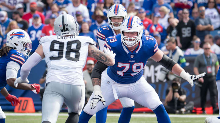 Sep 17, 2023; Orchard Park, New York, USA; Buffalo Bills offensive tackle Spencer Brown (79) prepares to block Las Vegas Raiders defensive end Maxx Crosby (98) to protect quarterback Josh Allen (17) in the fourth quarter at Highmark Stadium. Mandatory Credit: Mark Konezny-Imagn Images
