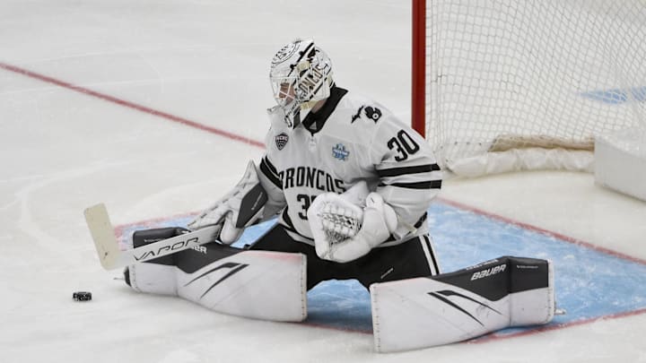 Apr 12, 2025; St. Louis, Missouri, UNITED STATES; Western Michigan Broncos goaltender Hampton Slukynsky (30) defends the net against the Boston University Terriers during the second period of the Frozen Four college ice hockey national championship at Enterprise Center. 