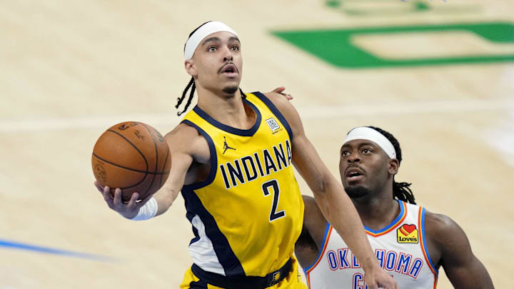 Indiana Pacers guard Andrew Nembhard (2) shoots the ball against Oklahoma City Thunder guard Luguentz Dort (5) during the third quarter in game one of the 2025 NBA Finals at Paycom Center. 