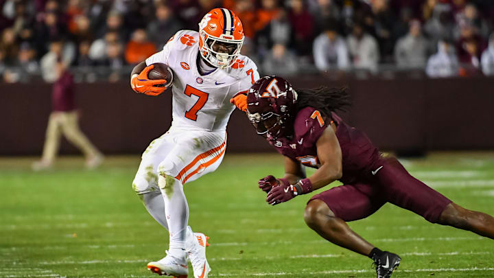 Nov 9, 2024; Blacksburg, Virginia, USA;  Virginia Tech Hokies linebacker Keonta Jenkins (7) dives to tackle Clemson Tigers running back Phil Mafah (7) during the fourth quarter at Lane Stadium. Mandatory Credit: Brian Bishop-Imagn Images