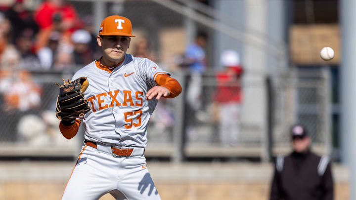 Texas pitcher Luke Harrison (53) tries to pick off a runner in game two of the Big 12 baseball series against Texas Tech, Saturday, March 9, 2024, at Rip Griffin Park.