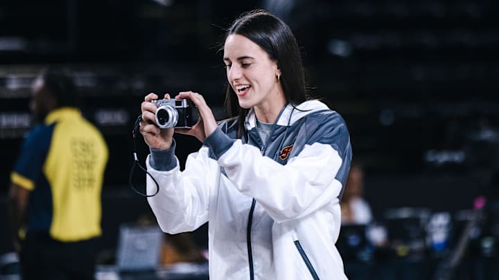 May 28, 2025; Washington, District of Columbia, USA; Indiana Fever guard Caitlin Clark takes photos of teammates before the game against the Washington Mystics at Entertainment & Sports Arena. Mandatory Credit: Emily Faith Morgan-Imagn Images