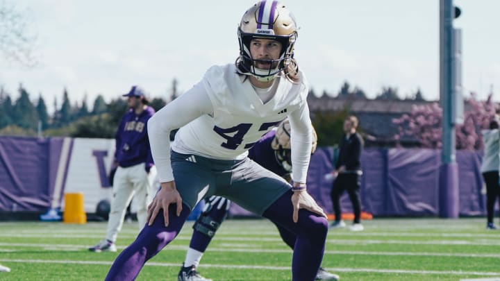 Punter Adam Saul stretches out in spring ball. 