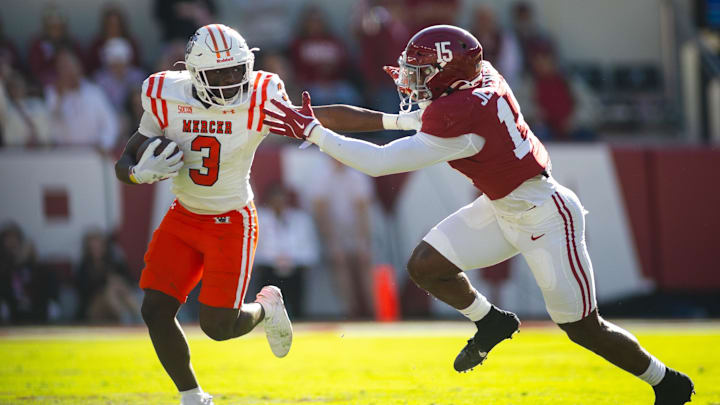 Nov 16, 2024; Tuscaloosa, Alabama, USA; Mercer Bears running back Dwayne Mcgee (3) stiff arms Alabama Crimson Tide linebacker Justin Jefferson (15) during the second quarter at Bryant-Denny Stadium. Mandatory Credit: Will McLelland-Imagn Images