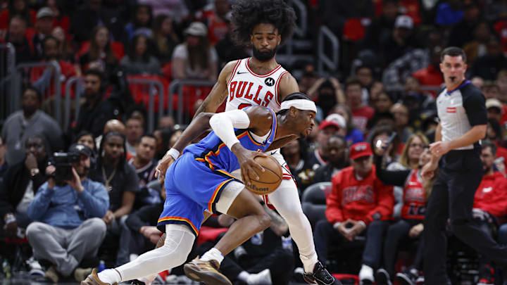 Oct 26, 2024; Chicago, Illinois, USA; Oklahoma City Thunder guard Shai Gilgeous-Alexander (2) drives to the basket against Chicago Bulls guard Coby White (0) during the first half at United Center. Mandatory Credit: Kamil Krzaczynski-Imagn Images Oct 26, 2024; Chicago, Illinois, USA; Oklahoma City Thunder guard Shai Gilgeous-Alexander (2) drives to the basket against Chicago Bulls guard Coby White (0) during the first half at United Center. Mandatory Credit: Kamil Krzaczynski-Imagn Images