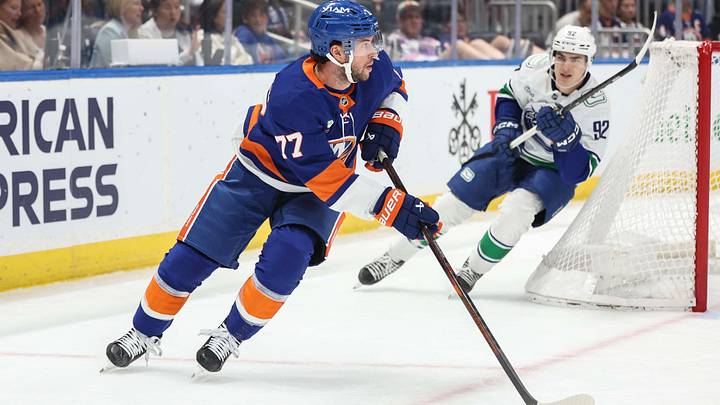 Oct 13, 2026; Elmont, New York, USA; New York Islanders defenseman Tony DeAngelo (77) controls the puck in the first period against the Vancouver Canucks at UBS Arena. Mandatory Credit: Wendell Cruz-Imagn Images Oct 13, 2026; Elmont, New York, USA; New York Islanders defenseman Tony DeAngelo (77) controls the puck in the first period against the Vancouver Canucks at UBS Arena. Mandatory Credit: Wendell Cruz-Imagn Images