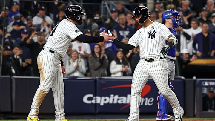 Oct 29, 2024; Bronx, New York, USA;  New York Yankees second baseman Gleyber Torres (25) reacts after hitting a three run home run against the Los Angeles Dodgers in the eighth inning during game four of the 2024 MLB World Series at Yankee Stadium. Mandatory Credit: Vincent Carchietta-Imagn Images