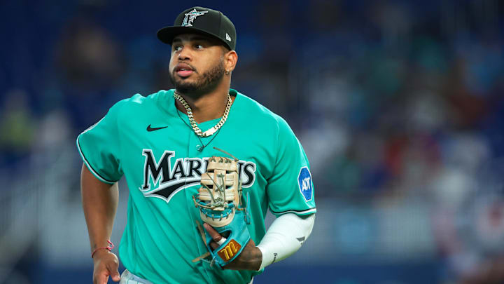 Mar 29, 2026: Miami Marlins first baseman Deyvison de Los Santos (63) returns to the dugout against the Colorado Rockies during the first inning at loanDepot Park. Mar 29, 2026: Miami Marlins first baseman Deyvison de Los Santos (63) returns to the dugout against the Colorado Rockies during the first inning at loanDepot Park.
